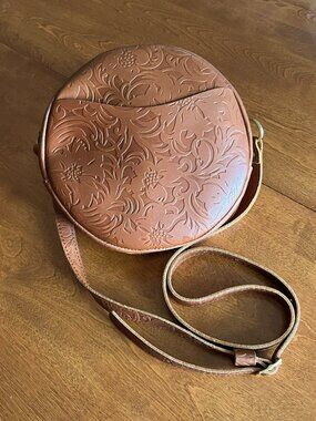 Portland Leather large circle crossbody tan embossed "Meadow"